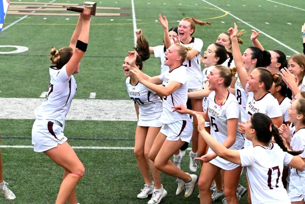 Captain Karleigh Mutch brings the joy and the final four trophy to the team. Photo by Terri Bono