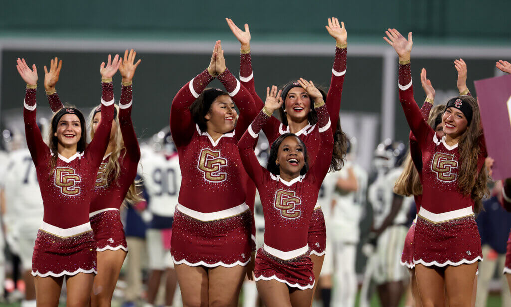 The CC cheer squad revs up the spectators.