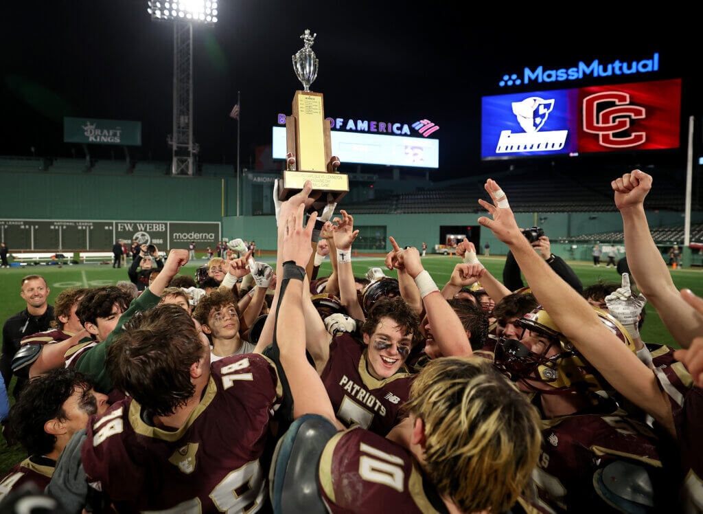 The Acton-Carlisle Patriots hoist the coveted trophy.