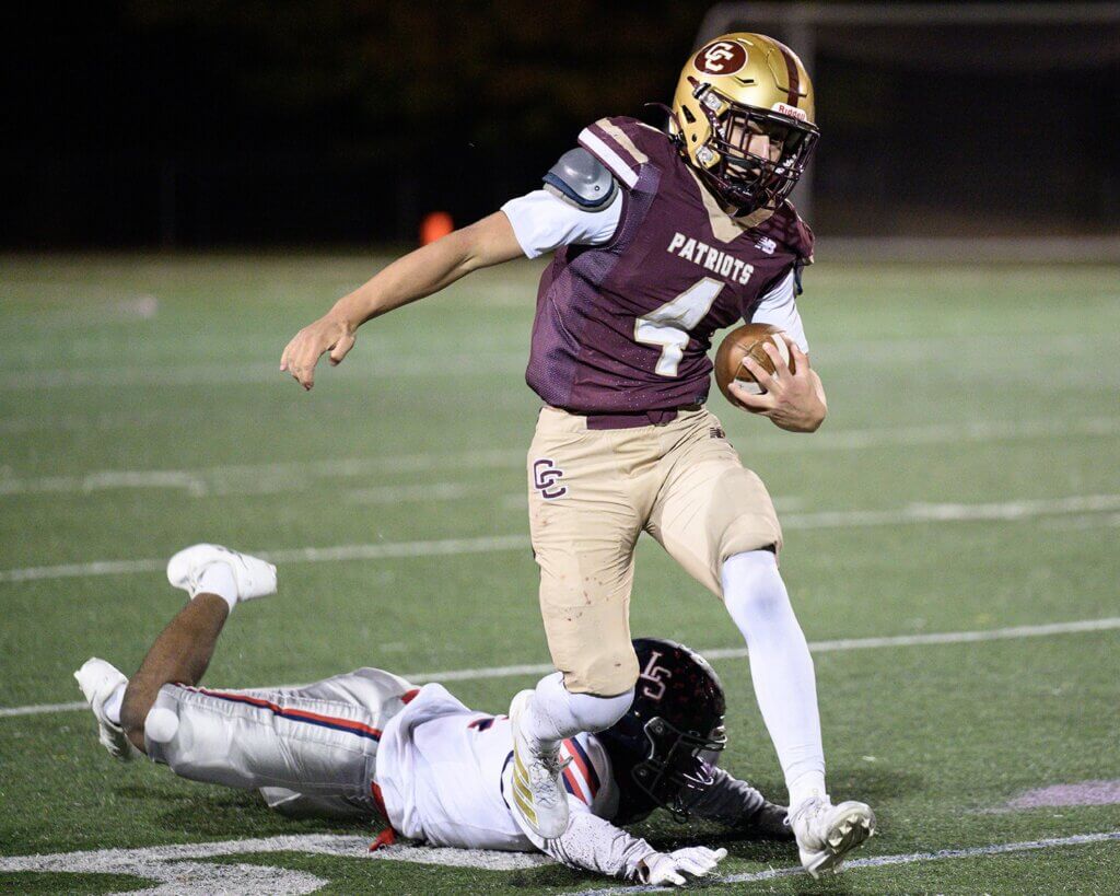Thomas Bury eludes Lincoln-Sudbury’s Stavaughn Harris (No. 2). Photo by Jon Straggas