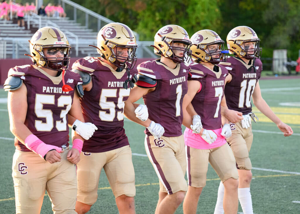 Co-captains Eric Nick (No. 53), Liam King (No. 53), Lewis Simon (No. 1), Finn Ruhmann (No. 7), and Christian Meyer (No. 10) will lead the Patriots against Lexington on November 26 at Fenway Park. Photo by Jon Straggas