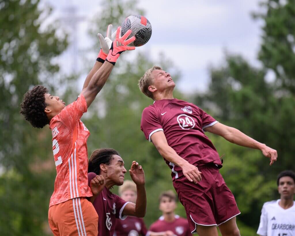 Acton-Carlisle’s Burke Breimyer (No. 24) lofts a header toward the goal during the first half against Dearborn Stem Academy on September 8. Photo by Jon Straggas