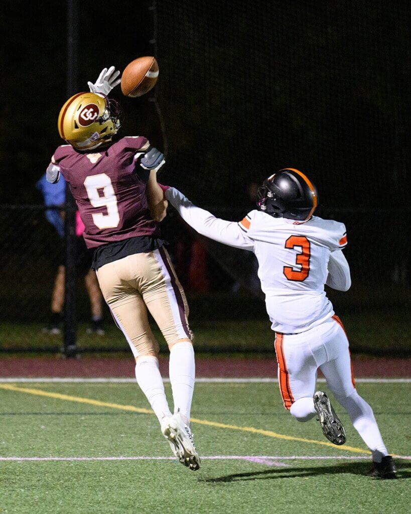 Peter Burke pulls down a pass from Wes Morse. Photo by Jon Straggas