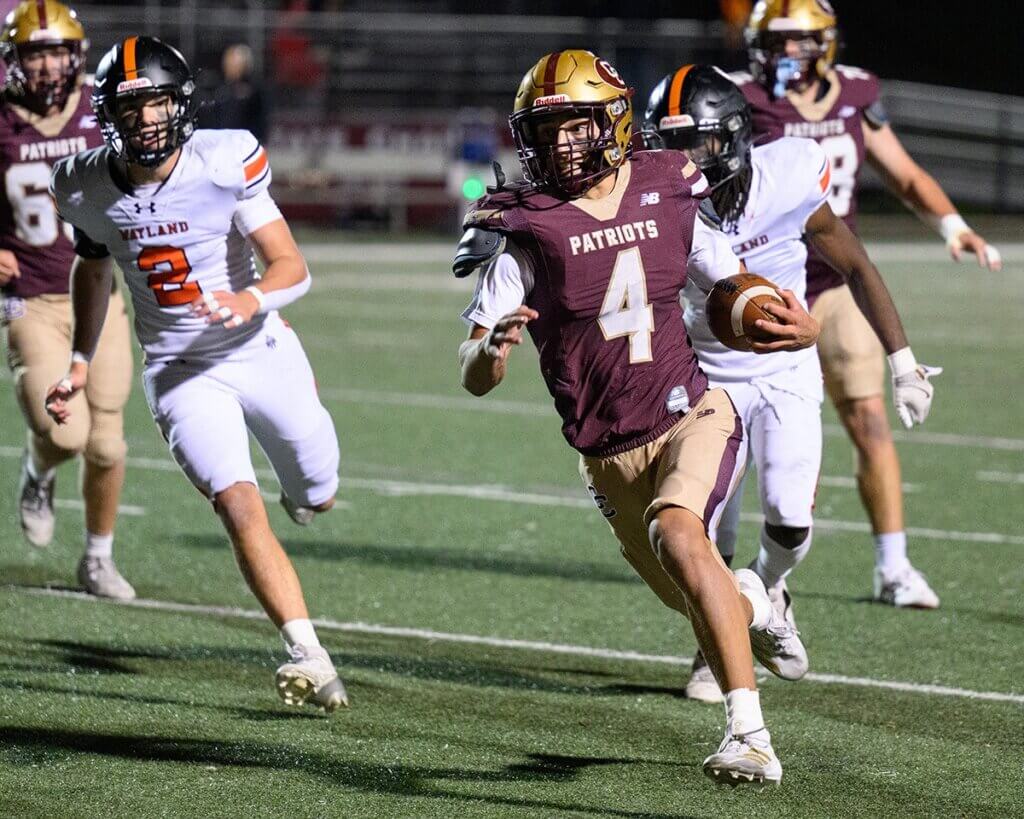 Thomas Bury heads to the end zone for the first of three touchdowns. Photo by Jon Straggas