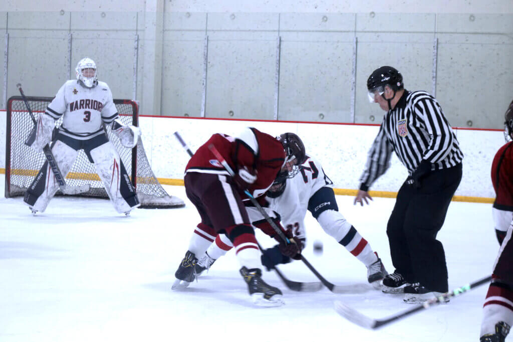 Cal Alexander takes the offensive zone face-off