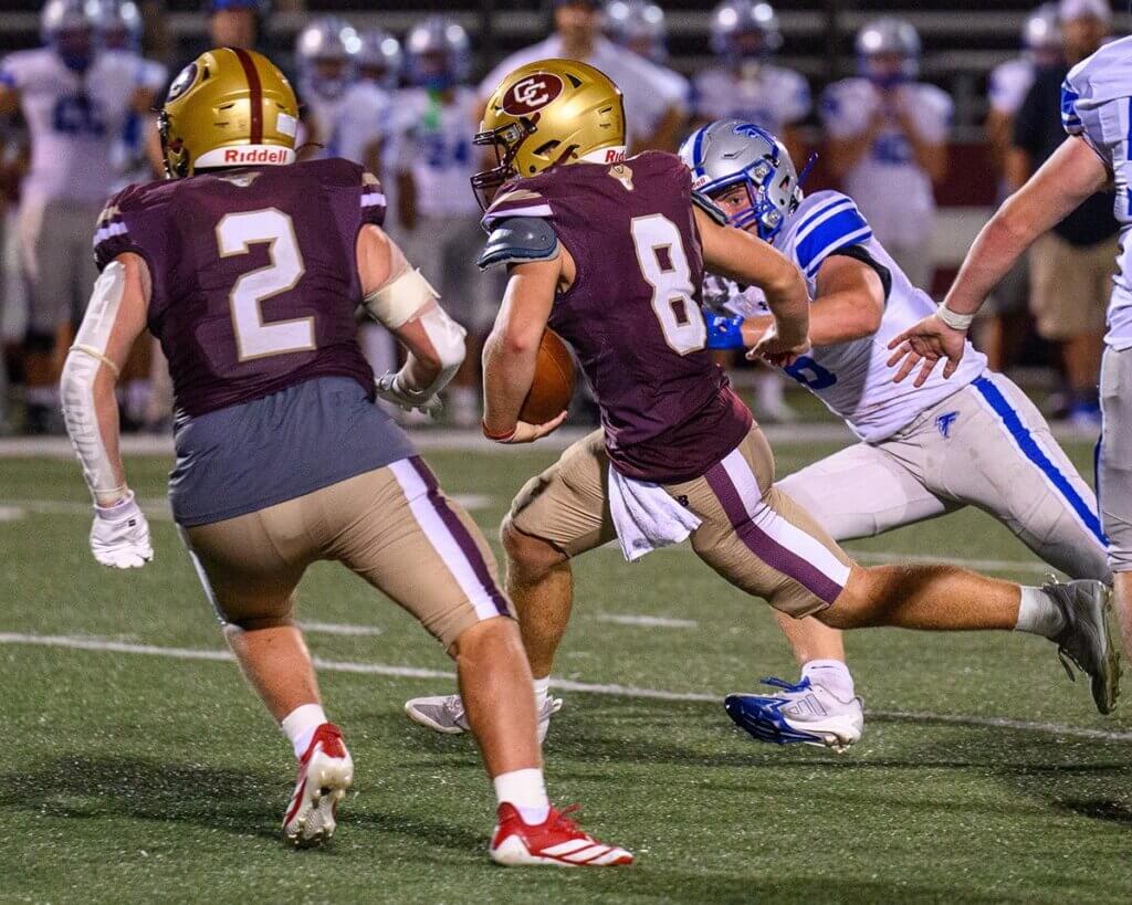 Quarterback Wes Morse (No. 8) on a touchdown run with help from Alex Fivek. Photo by Jon Straggas
