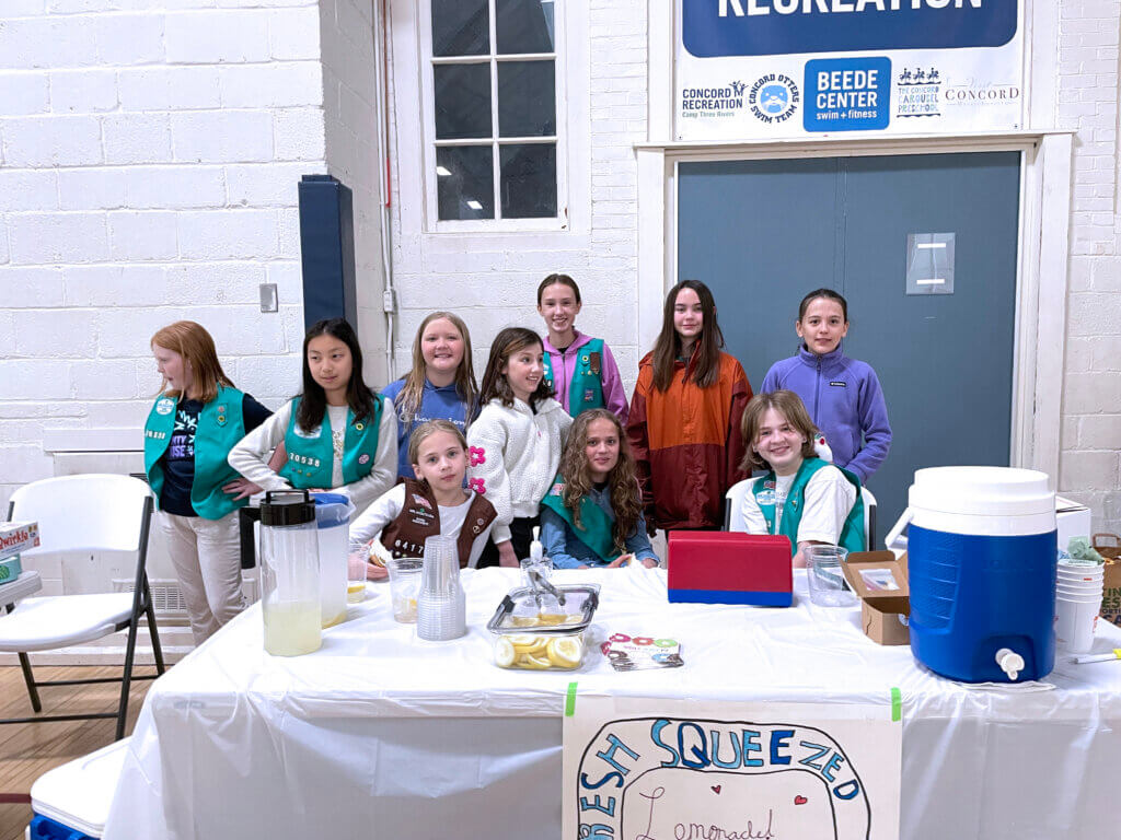 Troop 70538 sells homemade lemonade to raise money for pet shelter supplies. Back row: Julia Daniel, Kacey Chen, Evangeline Russell, Ellie Thomas, Leila Belov, Ariya Rooney, and Julia Cardinal. Front row: Eleanor Schoenfeld, Alya Desai, and Sylvia Schoenfeld. Courtesy photo