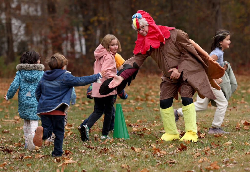 Willard Elementary School principal Matt Lucey high-fives runners during the school’s Turkey Trot on Friday, November 21, 2025. Ken McGagh/The Acton Bridge