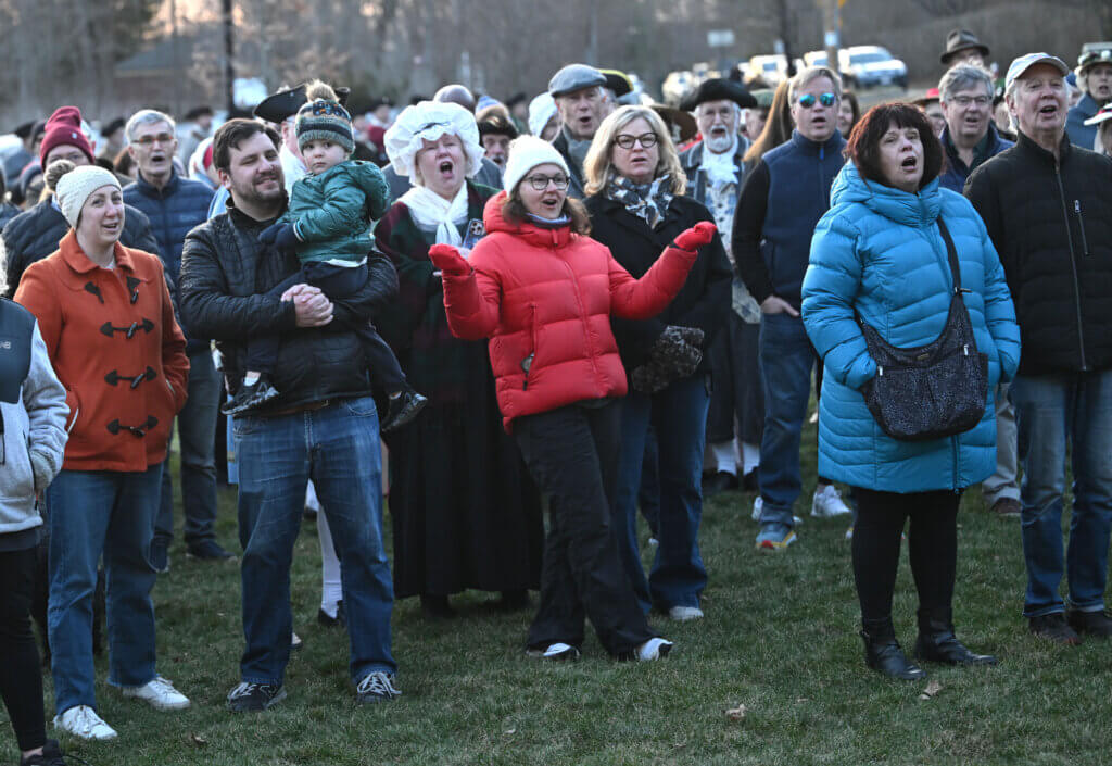 The crowd sings during the lantern lighting ceremony.