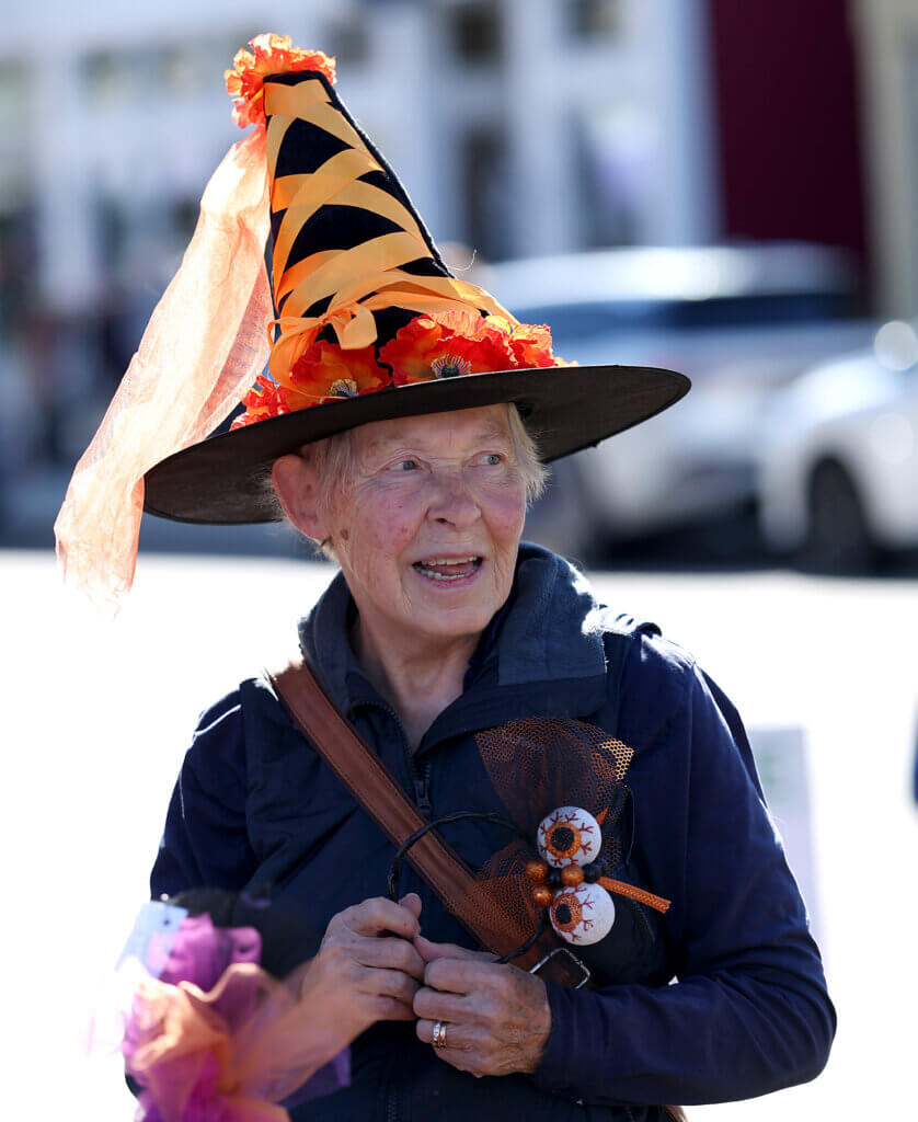 Louise Halstead of Belmont, formerly of Acton, sports a hat she purchased from the A New Leaf consignment shop at a previous Discover West Acton Day on Saturday, October 18, 2025. Ken McGagh/The Acton Bridge