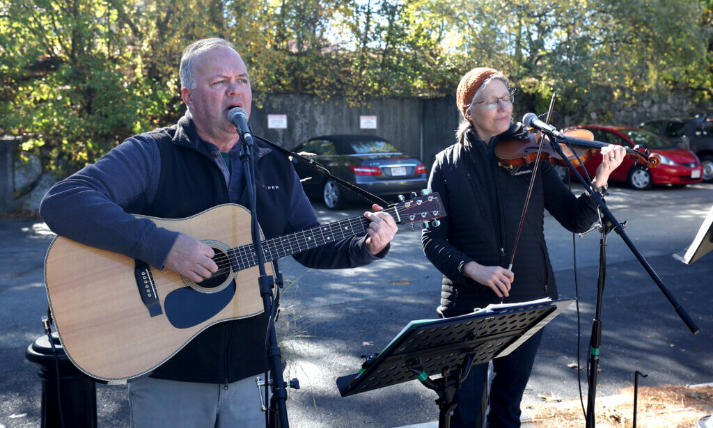 David Carter and Kristin Moore, both of Acton, perform as Due West in front of Acton Teacakes during Discover West Acton Day on Saturday, October 18, 2025. Ken McGagh/The Acton Bridge