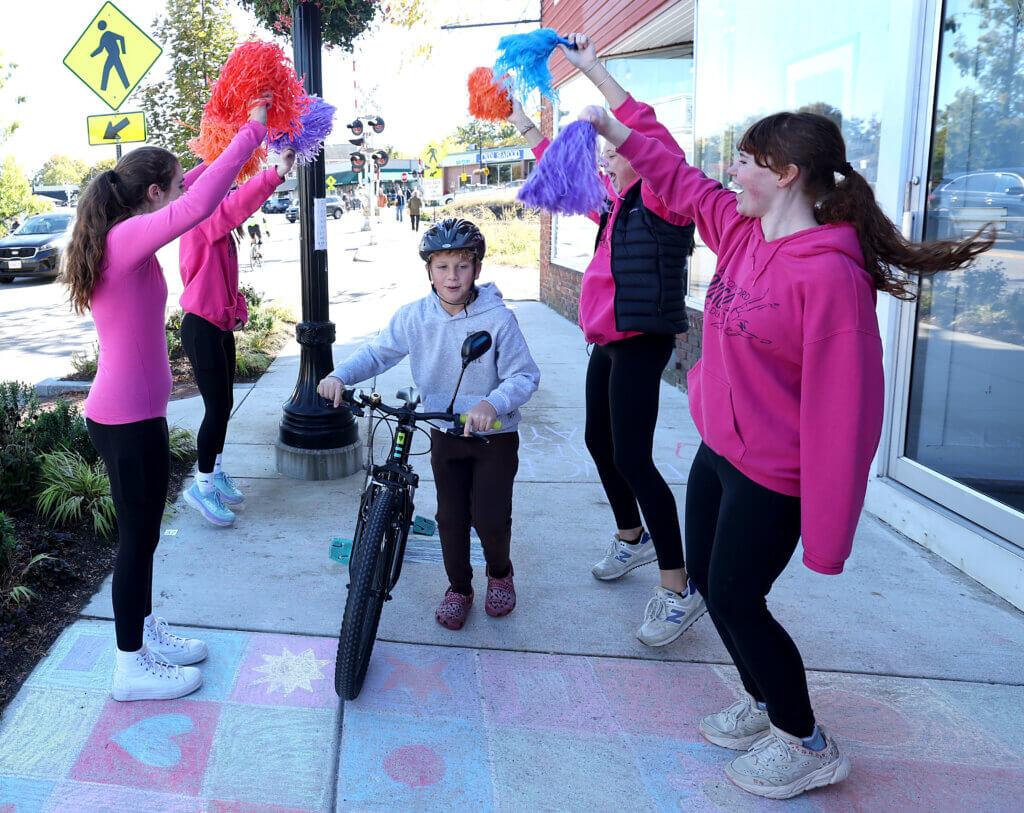 Dancers from the West Acton Dance Academy serenade passersby through their spirit tunnel during Discover West Acton Day on Saturday, October 18, 2025. Ken McGagh/The Acton Bridge