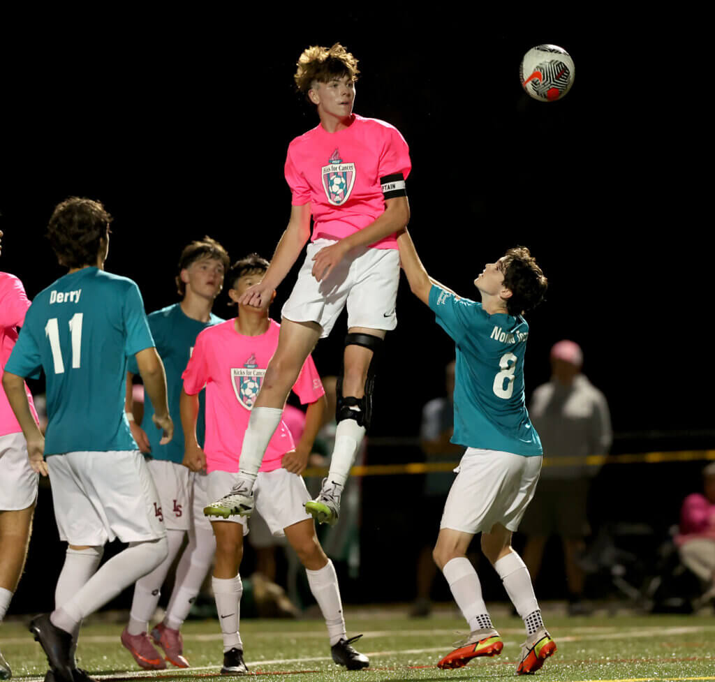 Acton-Carlisle senior Captain Tyler Shepard goes airborne for a header.
