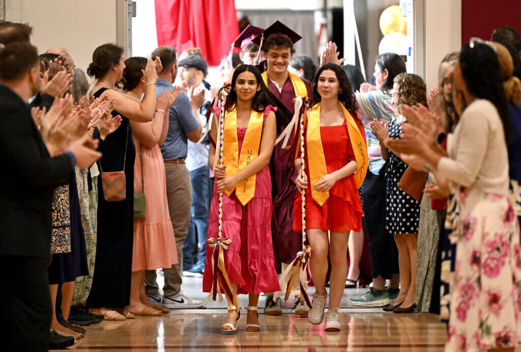 Marshals usher in members of the graduating class. Photo: Ken McGagh/The Acton Bridge 
