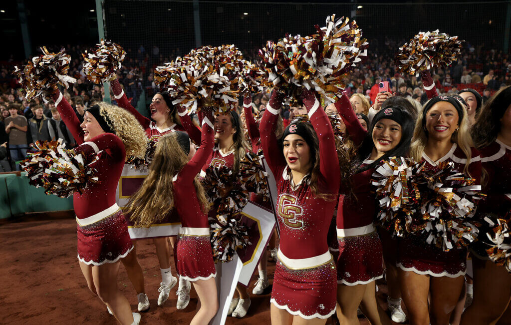 Acton-Carlisle cheerleaders wave for the Fenway Park Jumbotron.
