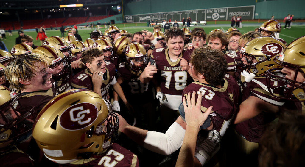 The Acton-Carlisle football team huddles at midfield after beating Lexington.
