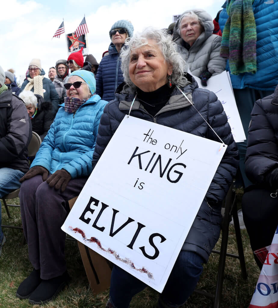 Concordian Joan Hilton pledged her fealty not to a king, but to The King, on a tongue-in-cheek sign. Photo: Ken McGagh/The Acton Bridge 
