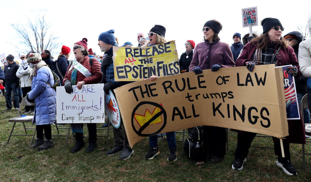 Sign-bearing protesters assemble at the start of the No Kings event. Photo: Ken McGagh/The Acton Bridge 
