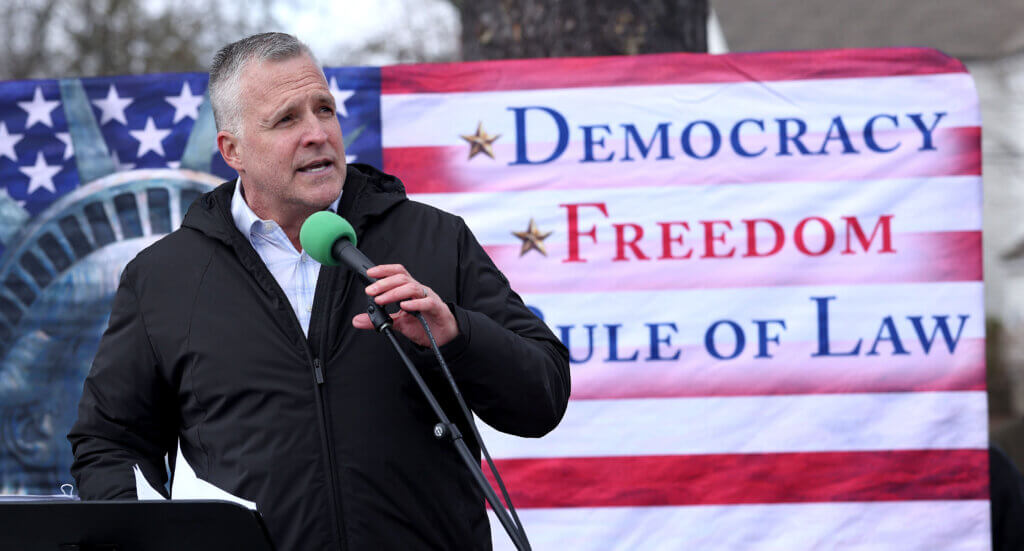 Acton resident Rufus Gifford, former U.S. ambassador to Denmark, delivers remarks. Photo: Ken McGagh/The Acton Bridge 
