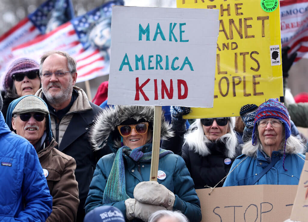 A bundled-up crowd listens to speakers at Alcott Elementary. Temperatures hovered in the 30s during the rally. Photo: Ken McGagh/The Acton Bridge 
