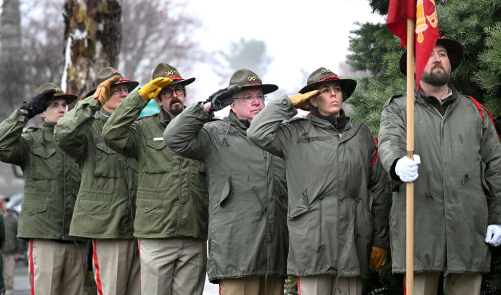 The Acton Indepenent Battery salutes as Acton firefighters raise the town’s new American flag in Acton Center on Saturday, April 12, 2025. Ken McGagh/The Acton Bridge