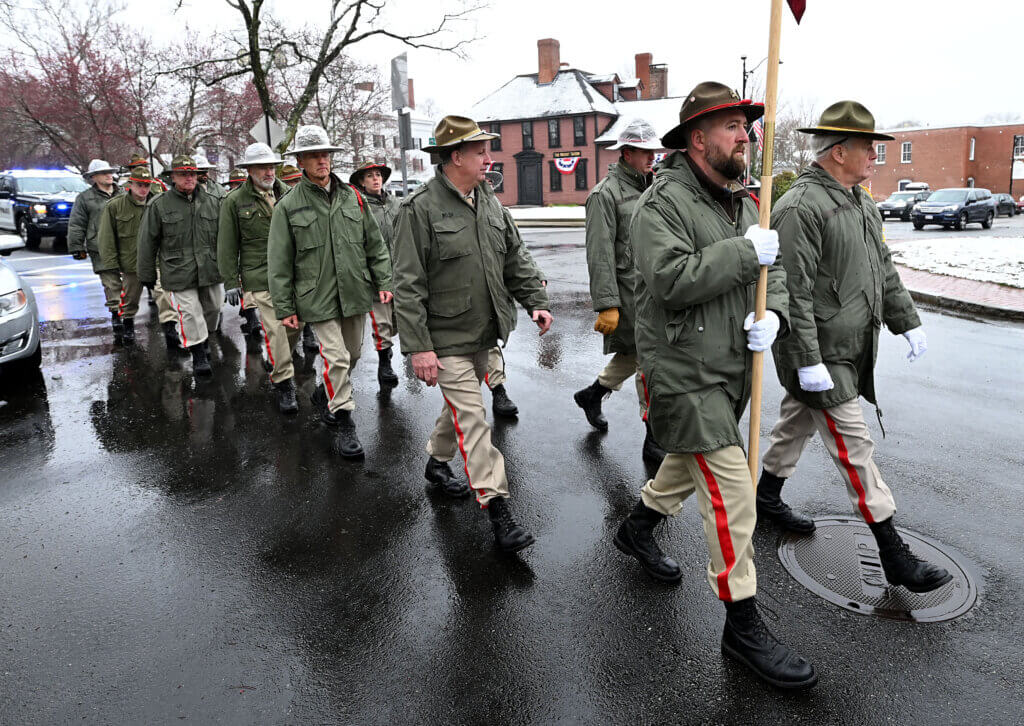 The Acton Independent Battery marches to Acton Center before presenting the town with a new American flag just in time for Patriots’ Day ceremonies on Saturday, April 12, 2025.  Ken McGagh/The Acton Bridge