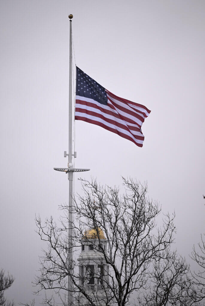 The new American flag, presented by the Acton Independent Battery and raised one week ahead of Patriots’ Day, flies in Acton Center on Saturday, April 12, 2025.  Ken McGagh/The Acton Bridge