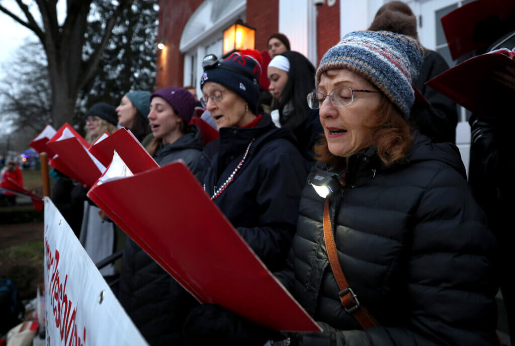 Vickie Cudmore, right, and other members of the Redeemer Presbyterian Church sing during the town’s annual Tree Lighting on Sunday, December 7, 2025. Ken McGagh/The Acton Bridge