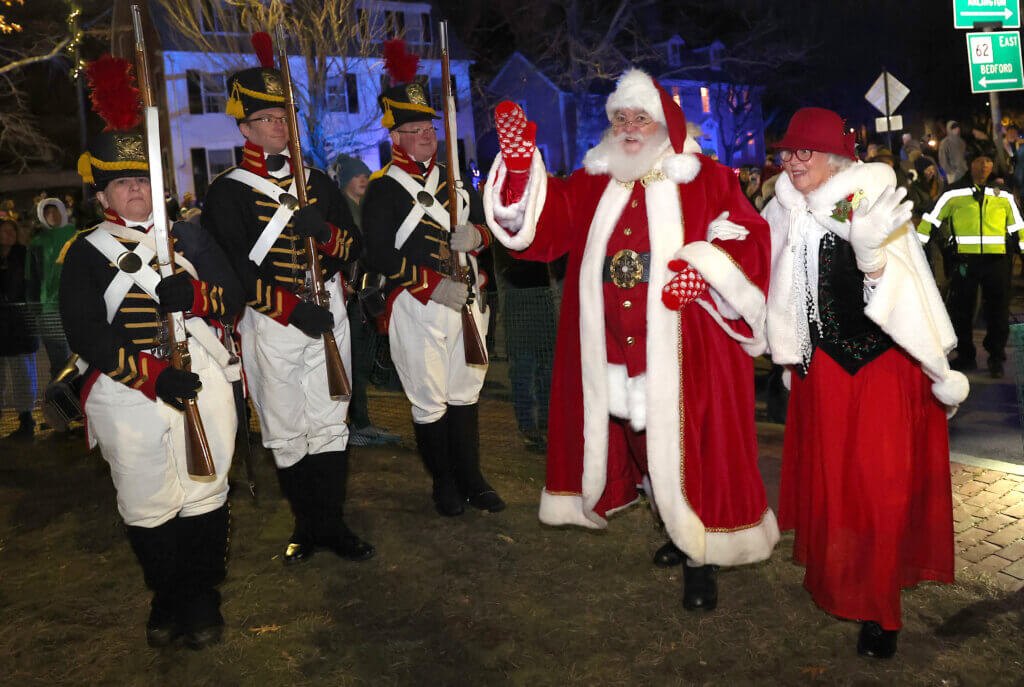 Santa Claus and Mrs. Claus arrive in Monument Square to light the town’s Christmas tree during the town’s annual Tree Lighting on Sunday, December 7, 2025. Ken McGagh/The Acton Bridge