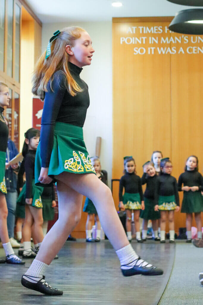 Mary McKenna takes her turn in front of the line of dancers. Photo: Trace Salzbrenner/The Acton Bridge