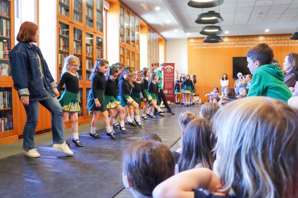 Flanked by their teachers, young dancers perform the traditional taps and skips of Irish dances. Photo: Trace Salzbrenner/The Acton Bridge