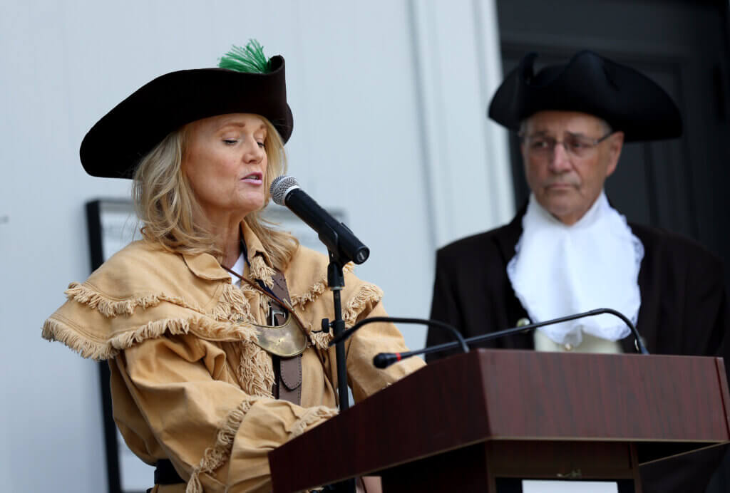 Mara Dolan of the Governor’s Council delivers her portion of the Declaration of Independence during “Declaring Independence Then and Now In Acton” on the steps of the First Parish in Acton on Saturday, July 11, 2026. Five community members took turns reading sections of the historic document. Ken McGagh/The Acton Bridge