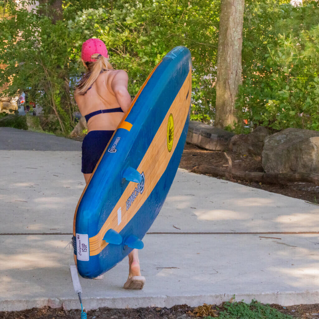 The stand-up paddleboard (SUP) is light enough for Caroline Minkin to carry solo. Photo by Jean Fain