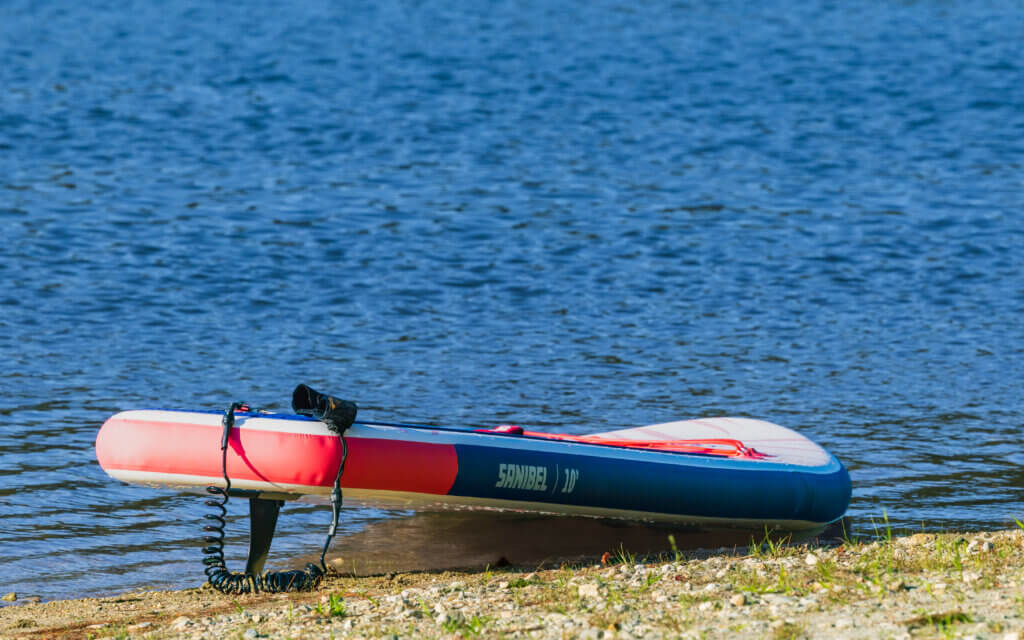 A SUP waits patiently on the shore. Photo by Jean Fain