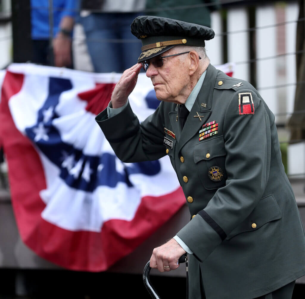 U.S. Army Col. Maynard Forbes (Ret.), 89, of West Acton, salutes during Memorial Day ceremonies in Monument Square.  Ken McGagh/The Acton Bridge 
