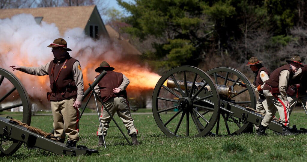 The Acton Independent Battery fires a cannon salute.
