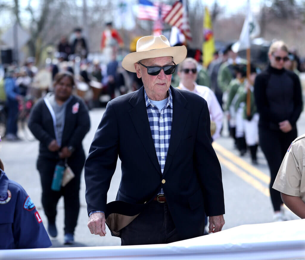 2026 Honored Citizen Pete Funkhouser marches in the parade.