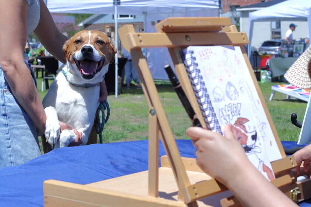 Artist Samara Reid caricatures Rosie the dog. Photo: Trace Salzbrenner/The Acton Bridge