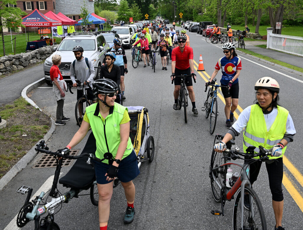 Cyclists prepare to depart the Acton Museum.