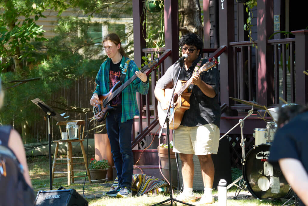 _DSC0966 Beat Wellington playing at 31 Derby Street; Daniel Edelman, Acton resident, plays the base while KK Gordon plays guitar and vocals. This band played almost all original music written by the band. Photo by Edward Feather