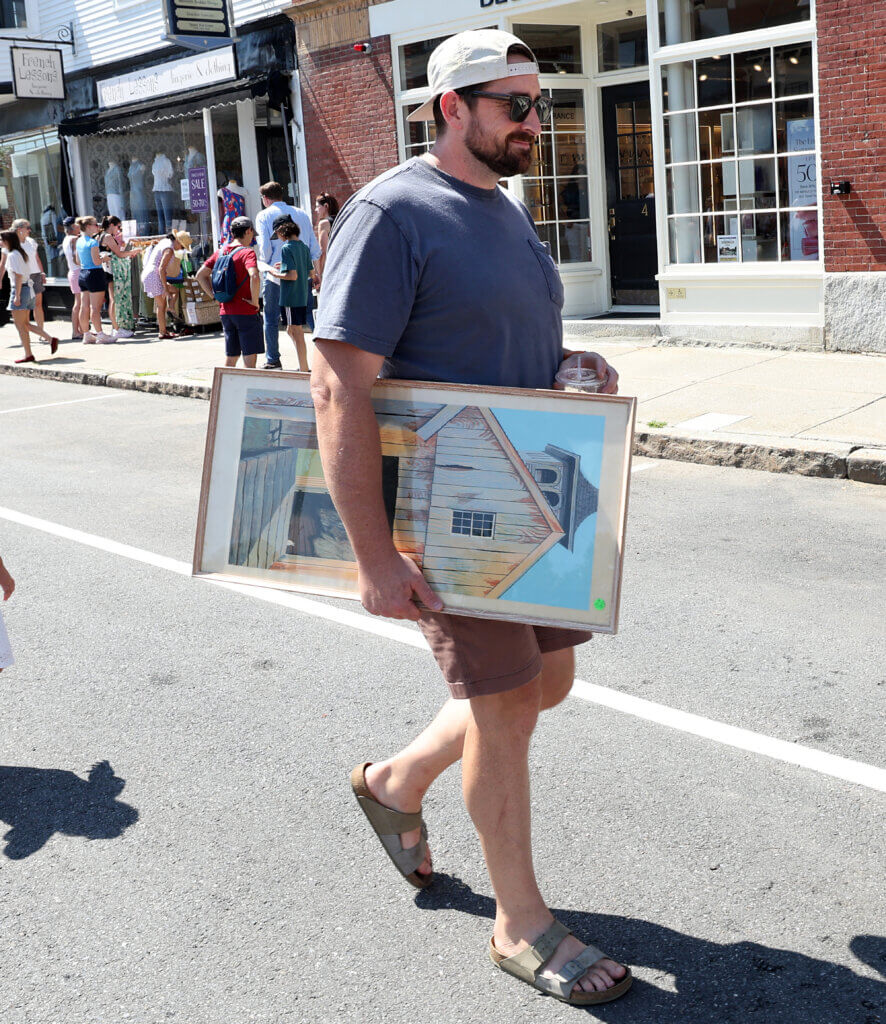 Tucker McDonald, visiting from Pennsylvania to attend a family reunion in Acton, picked up a painting.