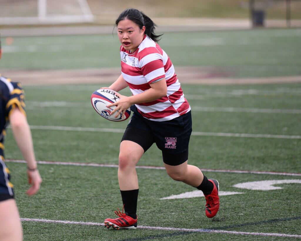 Lina Pu advances the ball for the Patriots and their L-S teammates. Photo by Jon Straggas