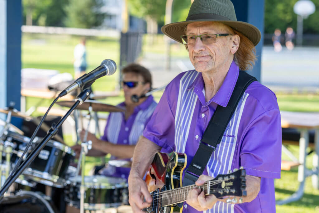 The Reminisants’ Tom Rates plays guitar as drummer John Strangis sets the tempo. Photo: Stephen Beyer/The Acton Bridge
