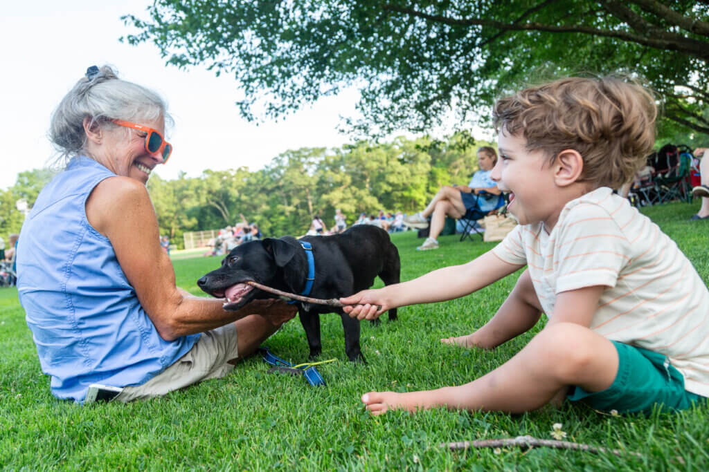 Marty Gilpatrick with grandson Wolf Mascia and puppy Roo. Photo: Stephen Beyer/The Acton Bridge