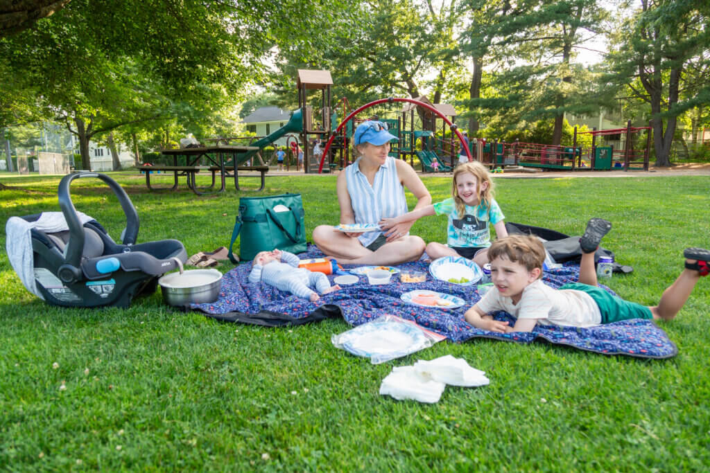 Molly Mascia and her family enjoy music and healthy treats — even as the children’s bedtime approaches to summon them home. Photo: Stephen Beyer/The Acton Bridge
