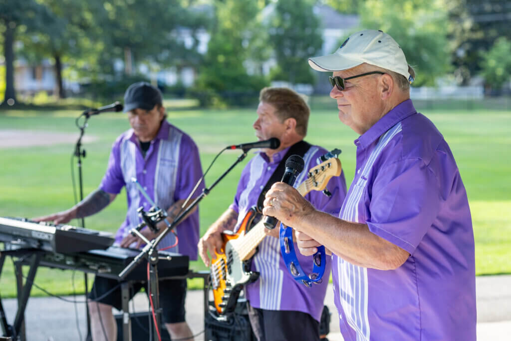 The Reminisants’ Jack Colombo, left, on keyboards and vocals, Jacques Raymond, center, on bass and vocals, and lead singer Mike Joyal entertain the crowd. Photo: Stephen Beyer/The Acton Bridge