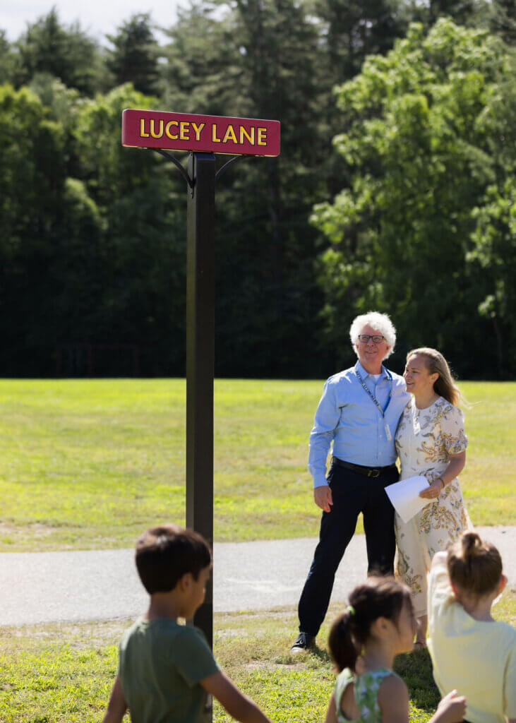 Lucey and Willard Parent Teacher Group Vice President Lauren Judge look at the new sign created by Billy Crosby of Crosby Design. Photo by Cole and Kiera Photography