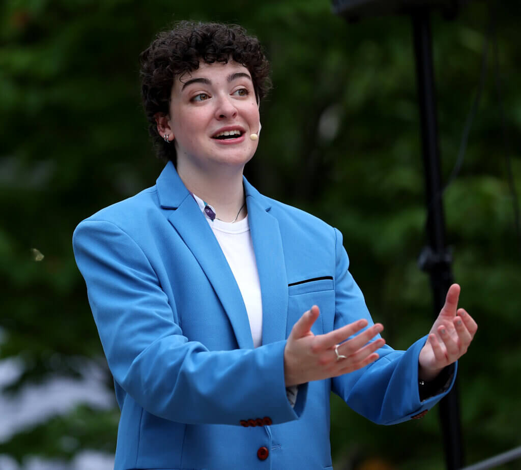 Sara Gluck as Romeo proclaims her love of Juliet during Acton Players presentation of “Romeo And Juliet” at the Acton Free Public Library lawn on Saturday, August 1, 2026. Gluck, 21, of Billerica, is a rising senior at Salem State and first-time performer for Acton Players. Ken McGagh/The Acton Bridge