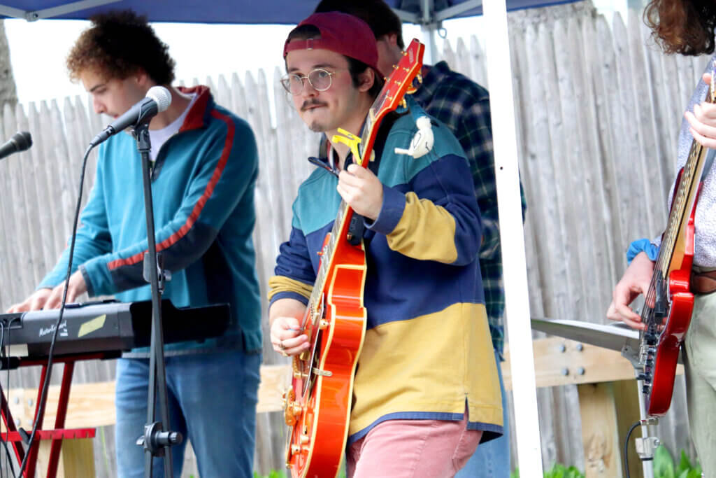 Julian Spector performs outside the Fowler Library. Photo: Trace Salzbrenner/The Acton Bridge