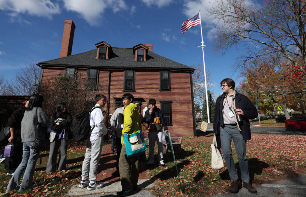 Jack McCarthy, right, the coordinator of international relations for the town of Nanae, Japan, leads his student delegration after a visit to the Wright Tavern on Tuesday, October 28, 2025. Ken McGagh/The Acton Bridge